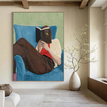 Load image into Gallery viewer, “Bookish Retreat” ,Soft green background, blue armchair, brown pants, white and red clothing, with a figure reading a book. DTP303
